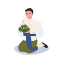 Loy Krathong Traditional Festival. man in Thai traditional dress is sitting and hold kratong and prepare to bring Krathong to Royalty Free Stock Photo