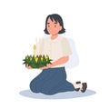 Loy Krathong Traditional Festival. Thai student girl is sitting and hold kratong and prepare to bring Krathong to float in river Royalty Free Stock Photo