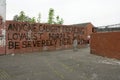 Loyalist warning message on a brick wall, Belfast.