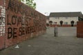 Loyalist warning message on a brick wall, Belfast.