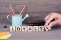 Loyalty. Wooden letters on dark background Royalty Free Stock Photo