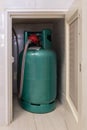 The LPG gas tank for cooking is stored in the small storage compartment