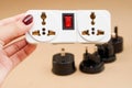 Lplug socket in hand and universal adaptor set Royalty Free Stock Photo