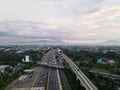 LRT , Monorail movement on track moving fast taken at station Cibubur. with background of traffic ,mountain and sky. Jakarta,