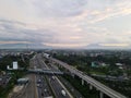 LRT , Monorail movement on track moving fast taken at station Cibubur. with background of traffic ,mountain and sky. Jakarta,