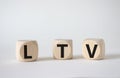 LTV - Life Time Value symbol. Concept word LTV on wooden cubes. Beautiful white background. Business and LTV concept. Copy space Royalty Free Stock Photo