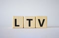 LTV - Life Time Value symbol. Concept word LTV on wooden cubes. Beautiful white background. Business and LTV concept. Copy space Royalty Free Stock Photo