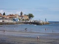 View of the port and the church of the small town of Luanco in Asturias, Spain. Europe.