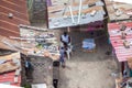 Aerial view of a african mother and her children in exterior patio on poor neighborhood in the central area of Luanda city