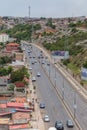 Aerial view at the samba road in the Luanda city downtown center with road, vehicles and buildings