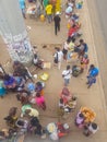 View of slum with a exterior market in the Luanda city downtown center with people selling and buying products