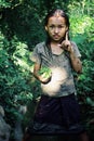 cute young girl with some vegetables she collected in the family garden