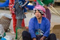 Luang Namtha, Laos - circa november, 2019: portrait adult Akha woman at market wearing traditional clothings belonging to minority