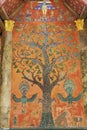 Exterior wall with beautiful tree mosaic of the pavilion at Xieng Thong temple in Luang Prabang, Laos.