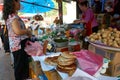 LUANG PRABANG, LAOS - APRIL 17. 2019 : Local selling food at the morning market in Luang Prabang, Laos