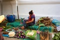 LUANG PRABANG, LAOS - APRIL 17. 2019 : Local selling food at the morning market in Luang Prabang, Laos