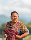 LUANG PRABANG, LAOS - JANUARY 11, 2017: Portrait of a laotian woman in the garden. Vertical. Copy space for text.