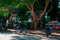 Luang Prabang, Laos, 12.17.18: Life in the streets of Luang Prabang. Man stands in front of a restaurant near the Mekong river.