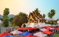 LUANG PRABANG, LAOS - MARCH 23, 2018: The Haw Pra Bang Temple near Royal Palace of Luang Prabang National museum with night market Royalty Free Stock Photo