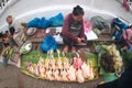 Vendors sale fresh chicken at the morning market, one of the largest traditional wet markets in Laos.