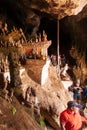 Tourists appreciating myriad Buddha statues