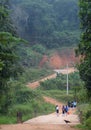 School girls going from home in a rural village to school in a morning