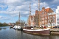 Lubeck, Germany, April 11, 2022: Historical wooden sailing ships in the museum harbor on the river Trave at the quay of the old
