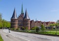 Lubeck, Germany - May 7, 2017: Summer view of The Holsten Gate or Holstentor in Lubeck old town - Germany, Schleswig-Holstein
