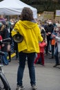 Lubeck, Germany, September 24, 2021: Young woman with megaphone from behind on the global Fridays for Future demonstration march