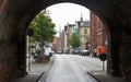 Lubeck, Germany - 07/26/2015 - View of street through the arch of Burgtor northern Gate, beautiful architecture