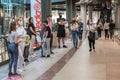 People in the shopping center with face masks due to coronavirus pandemic