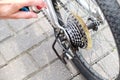 Applying oil on mountain bike chain. Man hands lubing bicycle chain. Technical expertise taking care Bicycle Shop