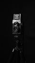 Lubitel camera on black background with little light