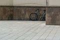 Lublin city street landscape, single bicycle is located near the wall, no people in the street