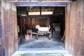 Lublin, Poland. 08 February 2023. Old wooden cart as seen through open door inside old rustic barn in open air museum Royalty Free Stock Photo