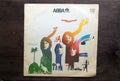 Lublin, Poland. 18 January 2023.ABBA The Album long play on dark wooden table