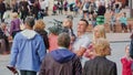 Couple with Child Talks on Litewski Square