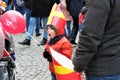 Little boy yawning at a celebration of St nicholas santa Claus nameday at `Orszak Swietego Mikolaja` Saint Nicholas Processio Royalty Free Stock Photo