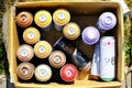 Lublin, Poland 08/05/2019 spray paint cans in cardboard box at