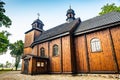 Lubowo, Poland - August 09, 2021. Old wooden st. Mikolaj Church - Kosciol pw. sw. Mikolaja Royalty Free Stock Photo