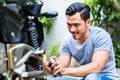 Man spraying grease in the motorbike