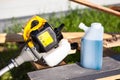 A lubricating oil mixed with gasoline for a two-stroke engine. Preparing grass trimmer for work Royalty Free Stock Photo
