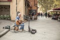 LUCCA, ITALY - OCTOBER 10, 2019: The guitar player sings on the street of Lucca Royalty Free Stock Photo