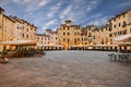 Lucca, Tuscany, Italy: the ancient elliptical Amphitheater square with outdoor bars and restaurants in the old town of the Royalty Free Stock Photo