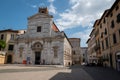 Lucca, Tuscany, Italy. August 2020. The facade of the church of Santi Giovanni e Reparata on a beautiful sunny day. People in the