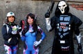 Two Cosplayer girls dressed as D.Va and man dressed as Reaper, characters from the Overwatch video game at the Lucca Comics 2022.