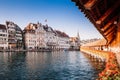 Lucerne Chapel Bridge and old buildings in bright evening, Switzerland Royalty Free Stock Photo