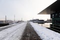 Lucerne, Switzerland, February 4, 2019: The culture and congress center KKL in Lucerne with a snowy footpath on a winter day