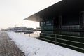 Lucerne, Switzerland, February 4, 2019: The culture and congress center KKL in Lucerne with a snowy footpath on a winter day