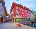 Scenic building with ornate wall paintings on the bank of Reuss river, on March 30 in Lucerne, Switzerland